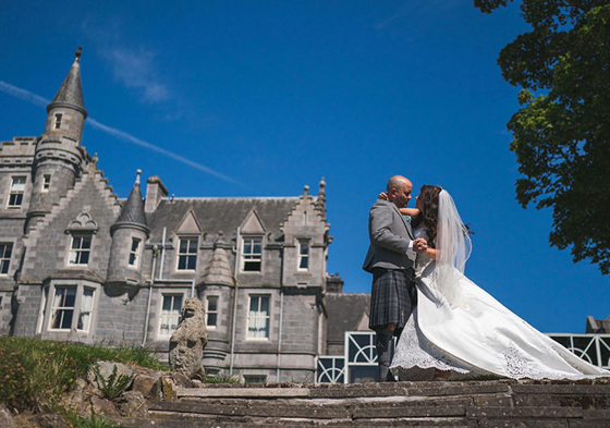 Bride and groom dance outside venue